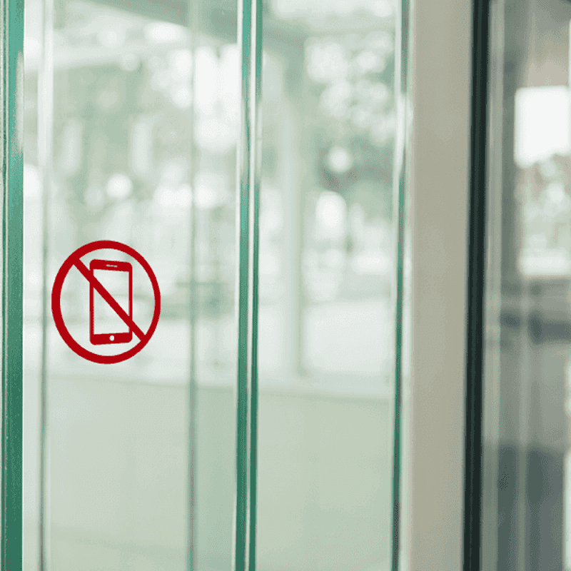 6" Round No Cell Phone Die Cut Vinyl Decal on a store window
