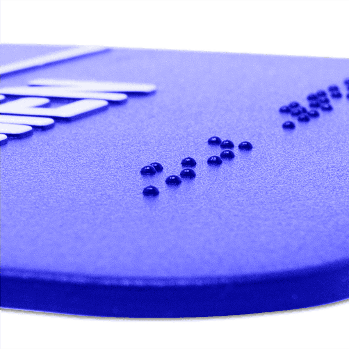 Close up of the braille on the ADA restroom sign