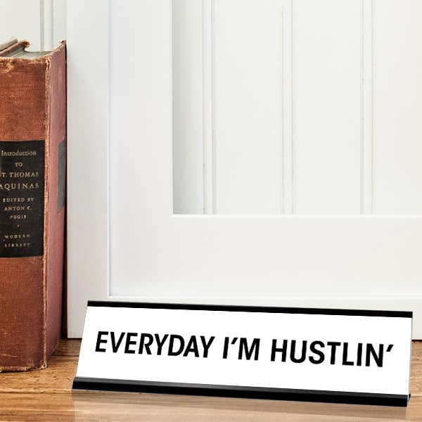 White desk plate with black custom text in black holder