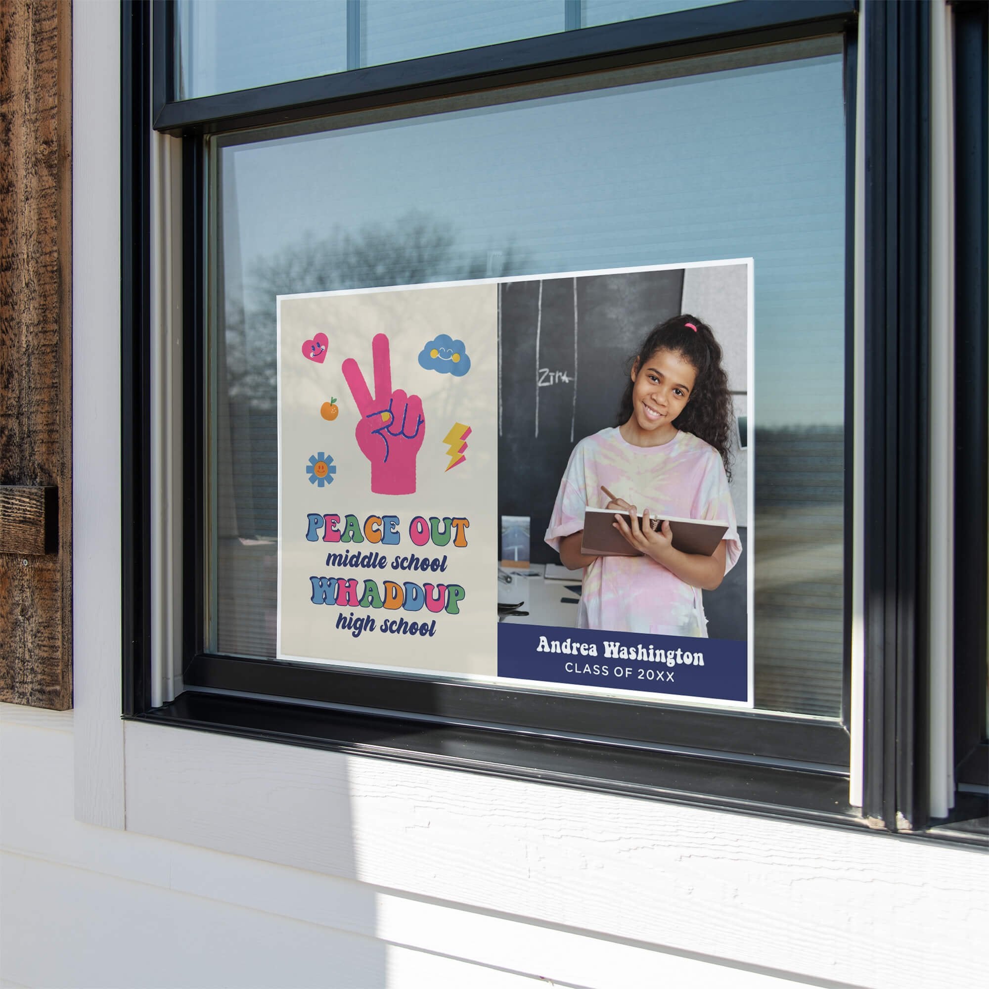 Peace out middle school graduation yard sign displayed in a window