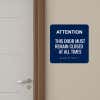 Blue ADA Sign Beside A Door Entryway