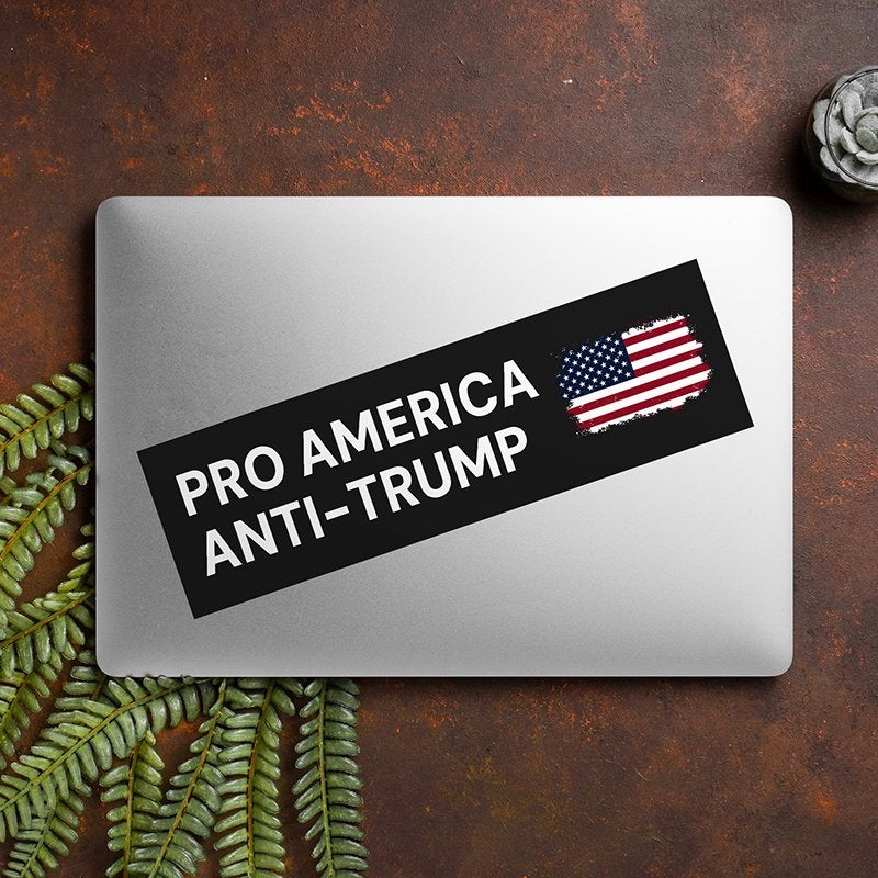 Pro America Anti Trump bumper sticker on a closed laptop