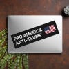 Pro America Anti Trump bumper sticker on a closed laptop