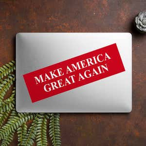 Make American Great Again Bumper Sticker on a closed laptop