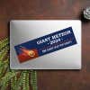 Giant Meteor Bumper Sticker on a closed laptop