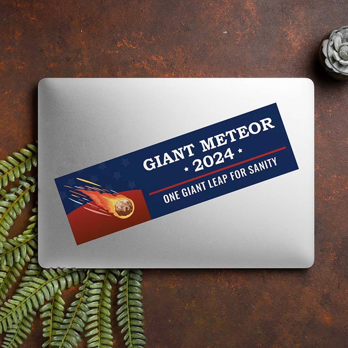 Giant Meteor Bumper Sticker on a closed laptop