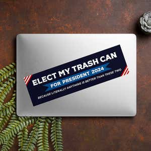 Elect My Trash Can Bumper Sticker on a closed laptop