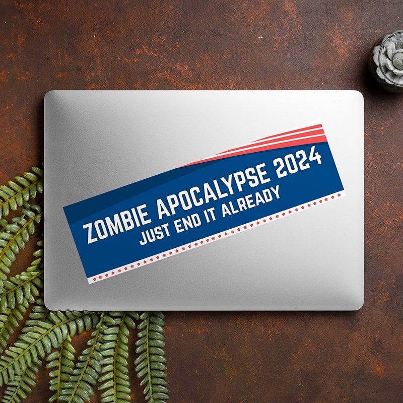 Zombie Apocalypse Political Bumper Sticker on a closed laptop