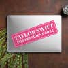Taylor Swift for President Bumper Sticker on a closed laptop