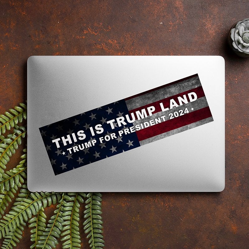 This is Trump Land Bumper Sticker on a closed laptop