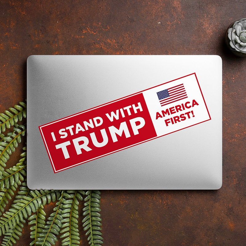 I Stand with Trump Bumper Sticker on a closed laptop
