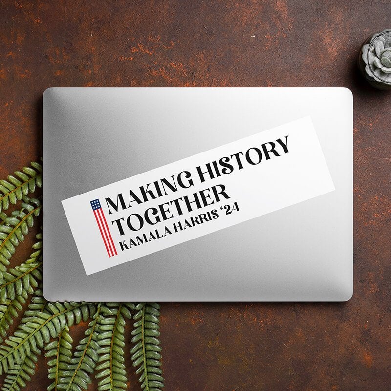 Make History Together | Harris Bumper Sticker on a closed laptop