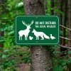 A Wildlife Conservation Aluminum Sign Mounted on a Tree