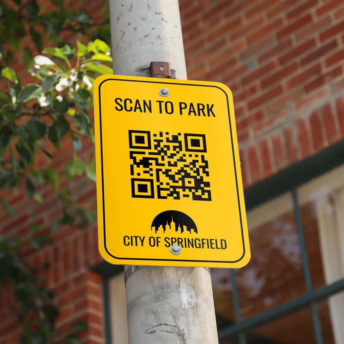 A Scan-to-Park QR Card on an Aluminum Sign Mounted to a Tree