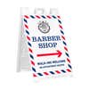 Barber shop A-frame sidewalk sign in white plastic frame, angled view