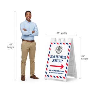 Barber shop A-frame sign shown with size dimensions beside a man
