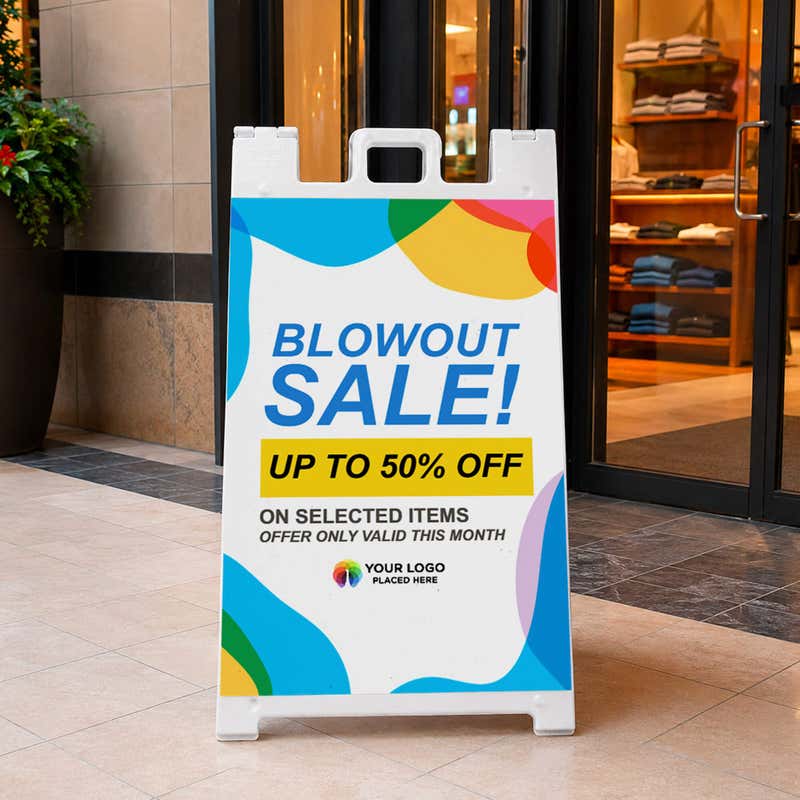 Blowout sale A-frame sidewalk sign displayed in front of a shop