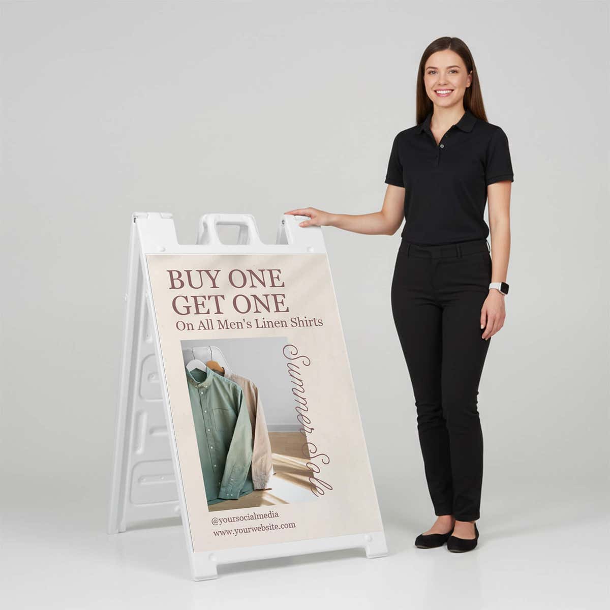 Woman standing beside a BOGO A-frame sign for scale