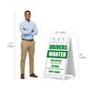 Drivers wanted A-frame sign shown with size dimensions beside a man