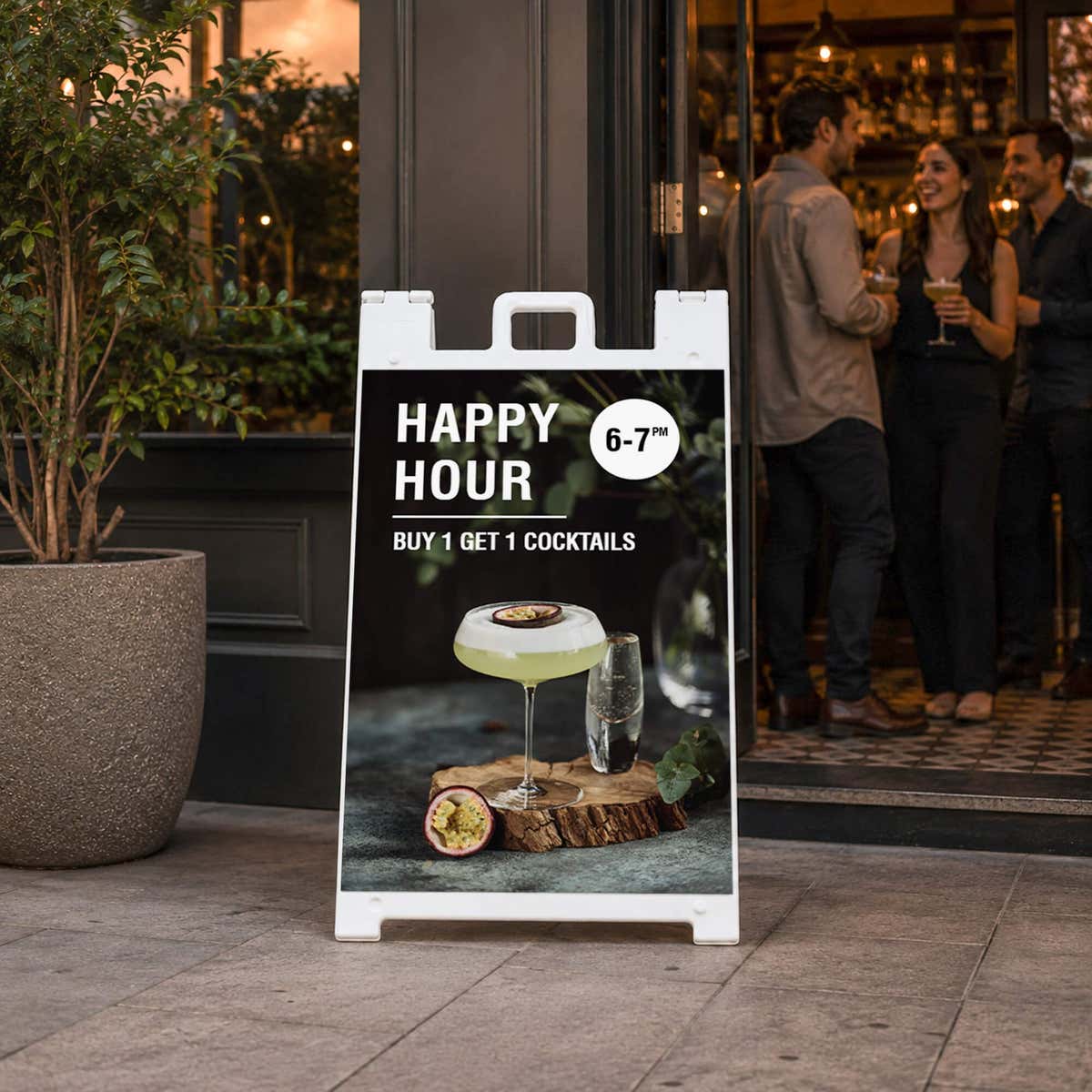 Happy hour A-frame sidewalk sign displayed in front of a store