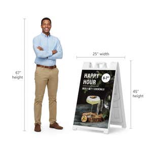 Happy hour A-frame sign shown with size dimensions beside a man