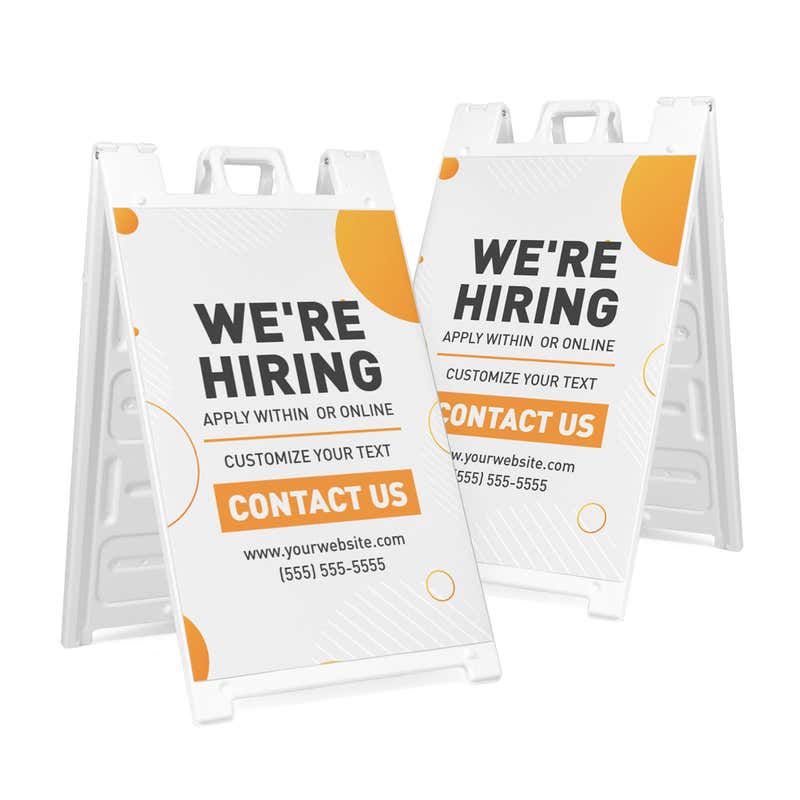 Two orange now hiring A-frame sidewalk signs shown front and angled