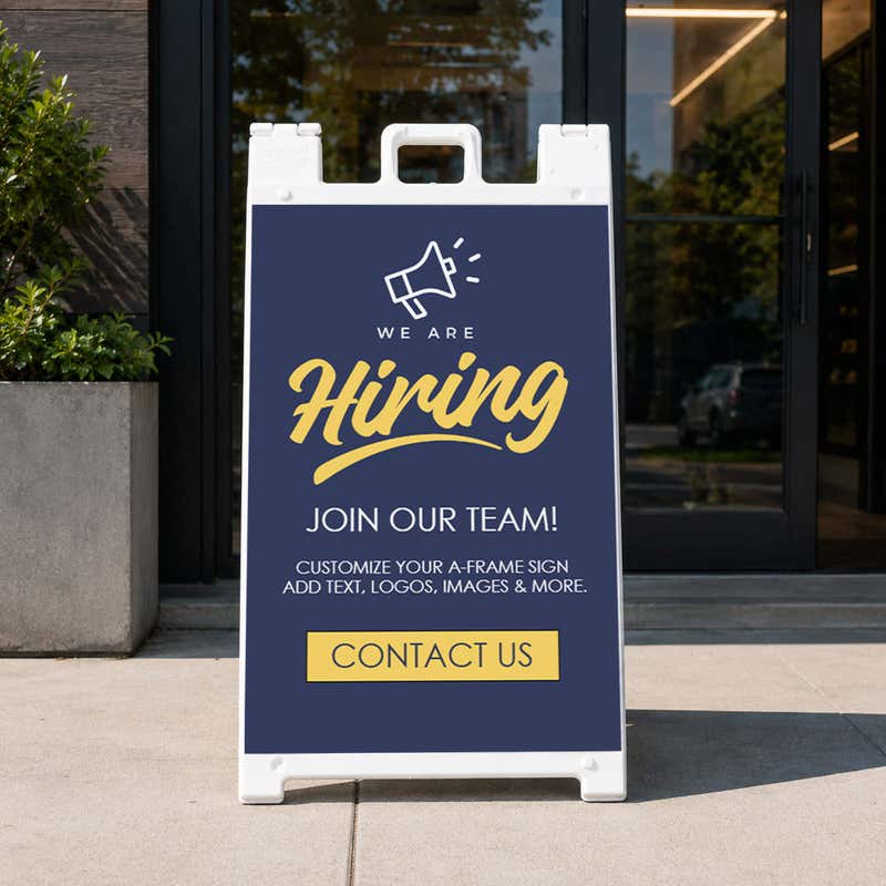 Blue now hiring A-frame sidewalk sign displayed in front of a business