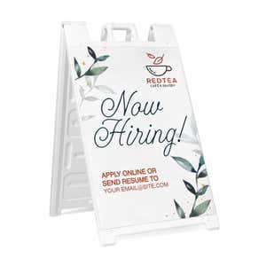 Floral now hiring A-frame sidewalk sign in white plastic frame, angled view