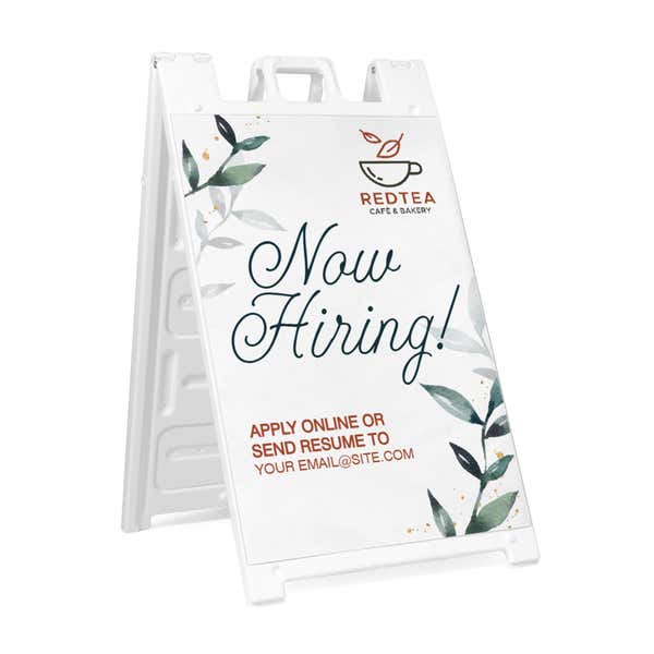 Floral now hiring A-frame sidewalk sign in white plastic frame, angled view