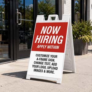 Red now hiring A-frame sidewalk sign displayed in front of a business