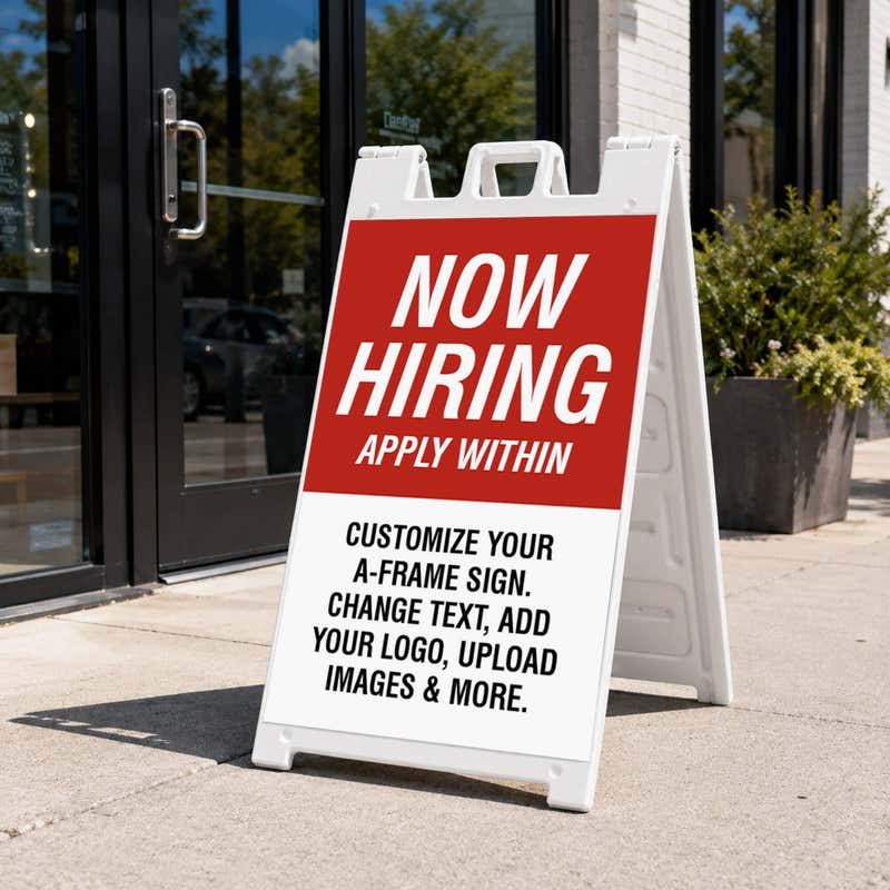 Red now hiring A-frame sidewalk sign displayed in front of a business