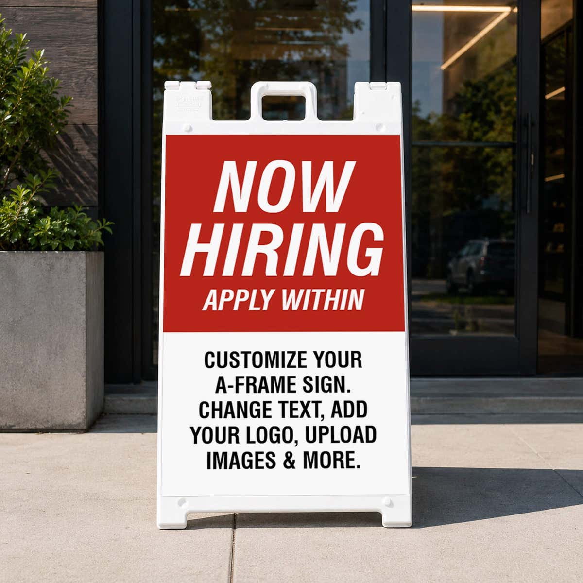 Red now hiring A-frame sidewalk sign displayed in front of a business