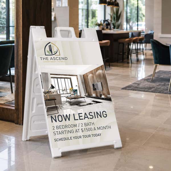 Now leasing A-frame sign at an apartment leasing office