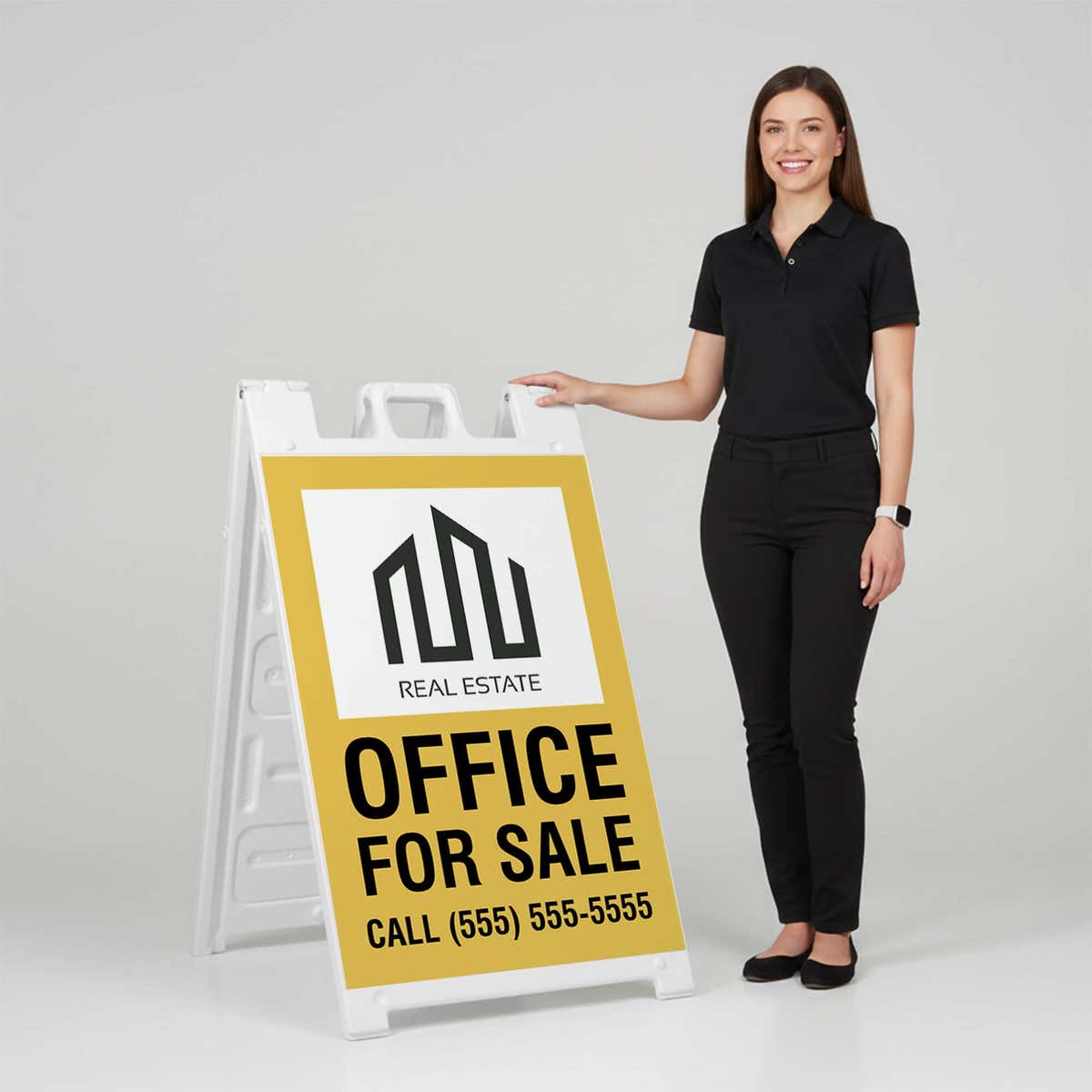 Woman standing beside a office for sale A-frame sign for scale