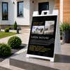 Modern open house real estate A-frame sign on a home front porch