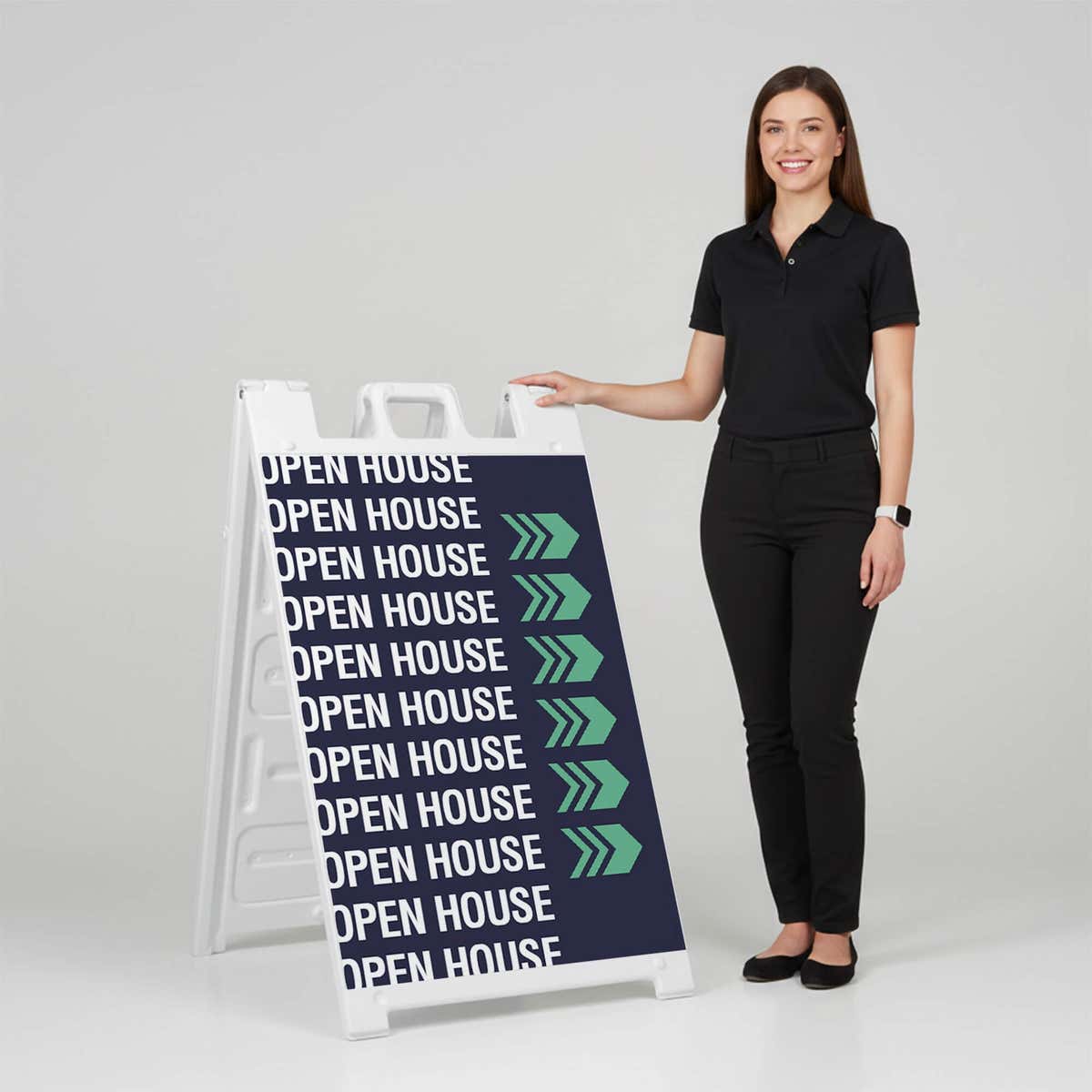 Woman standing beside a patterned open house A-frame sign for scale
