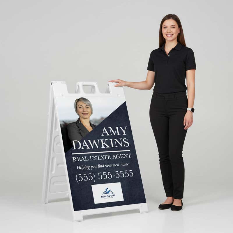 Woman standing beside a diagonal real estate A-frame sign for scale