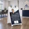 Diagonal real estate A-frame sign in a real estate office