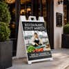 Restaurant staff wanted A-frame sign standing on a sidewalk