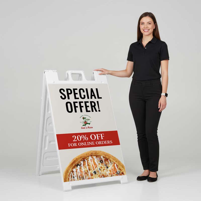 Woman standing beside a special offer A-frame sign for scale