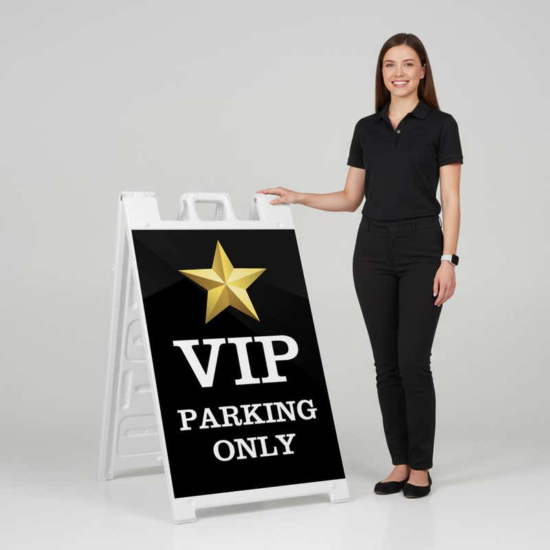 Woman standing beside a VIP parking A-frame sign for scale