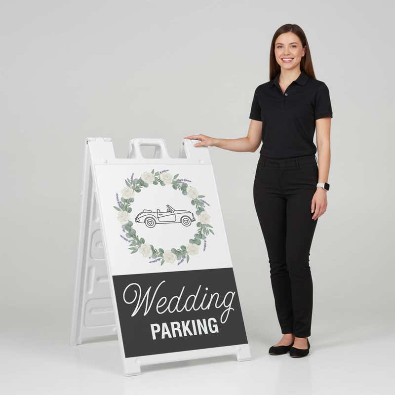 Woman standing beside a wedding parking A-frame sign for scale