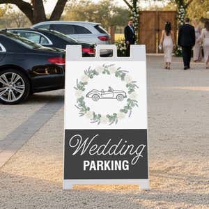 Wedding parking A-frame sign displayed in a gravel parking lot