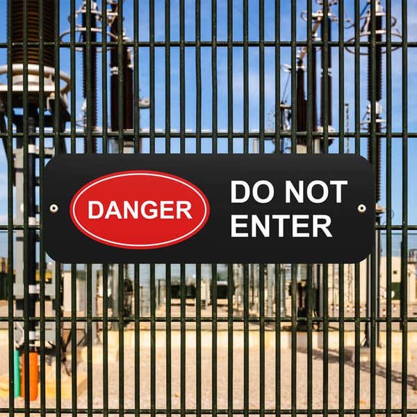 Black sign that reads “Do Not Enter” in white and red oval Danger Icon in white text