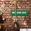 Custom green sign that reads “Jim’s Man Cave” in white text, wall sign for personal spaces