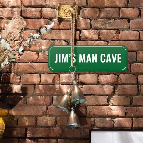 Custom green sign that reads “Jim’s Man Cave” in white text, wall sign for personal spaces