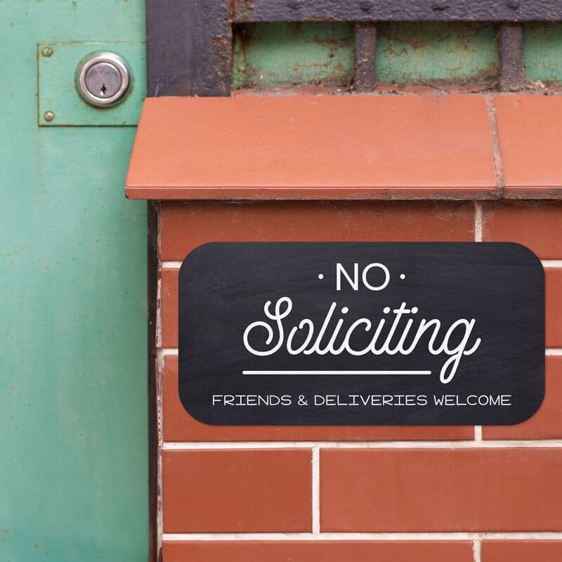Black background custom 6”x12” sign that reads No Soliciting, Friends and Deliveries Welcome