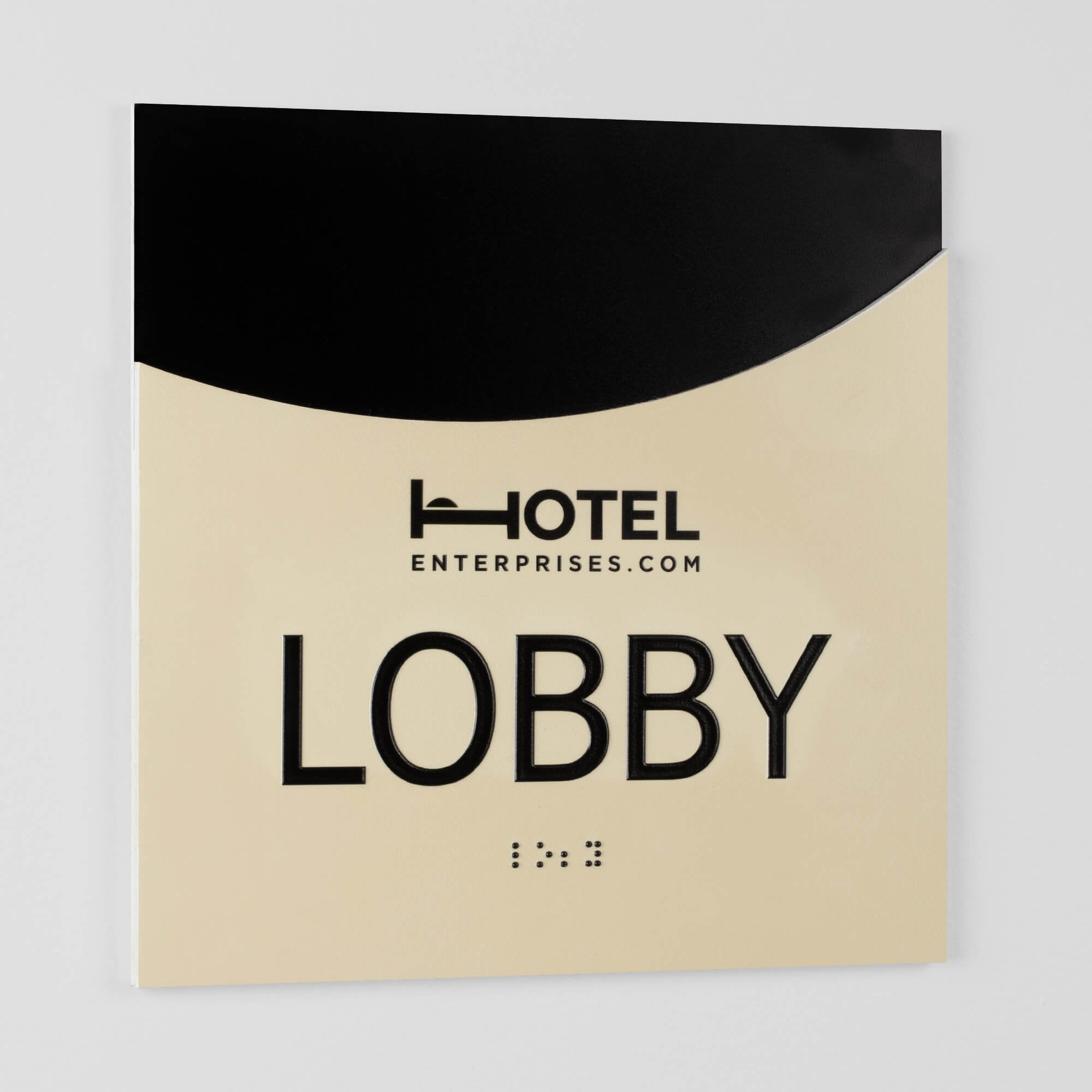 The 2-layered modern arch ADA sign for a lobby standing on a table at an angle to see the layers The 2-layered modern arch ADA sign for a lobby standing on a table at an angle to see the layers