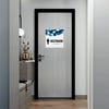 A 2-layered ADA sign for a restroom with a white foreground and a blue geometric background