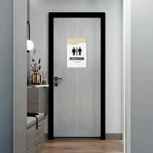 A 2-layer ADA sign for a restroom with a white foreground and the modern geometric background